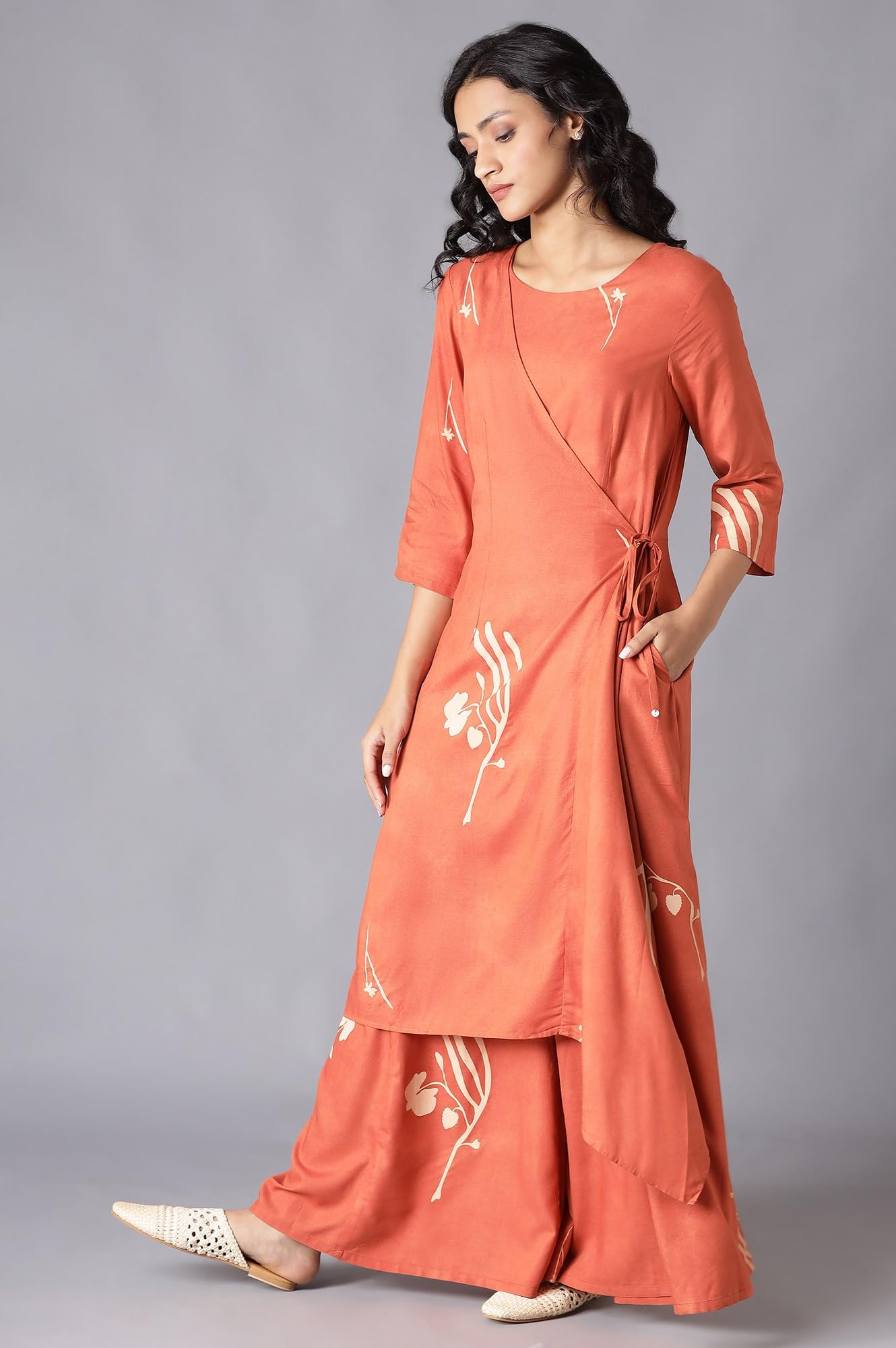 W Orange Floral Printed Stylised Jumpsuit for Women