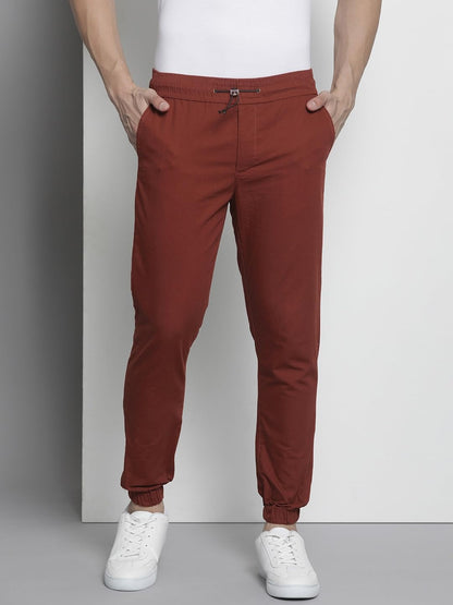 The Indian Garage Co Men Slim Fit Solid Mid-Rise Woven Joggers Orange