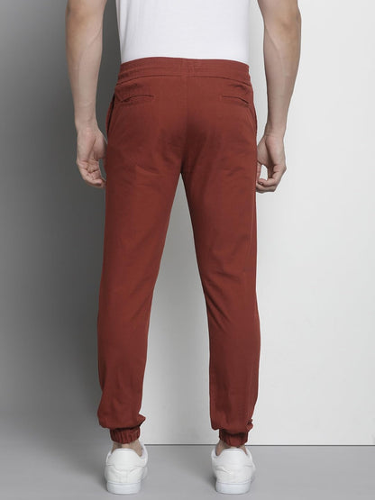 The Indian Garage Co Men Slim Fit Solid Mid-Rise Woven Joggers Orange