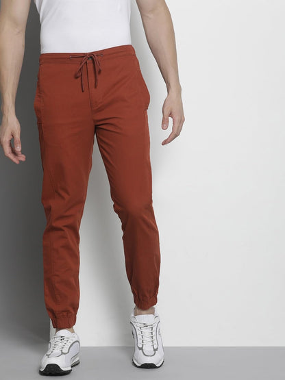 The Indian Garage Co Men Regular Fit Solid Mid-Rise Woven Joggers Orange