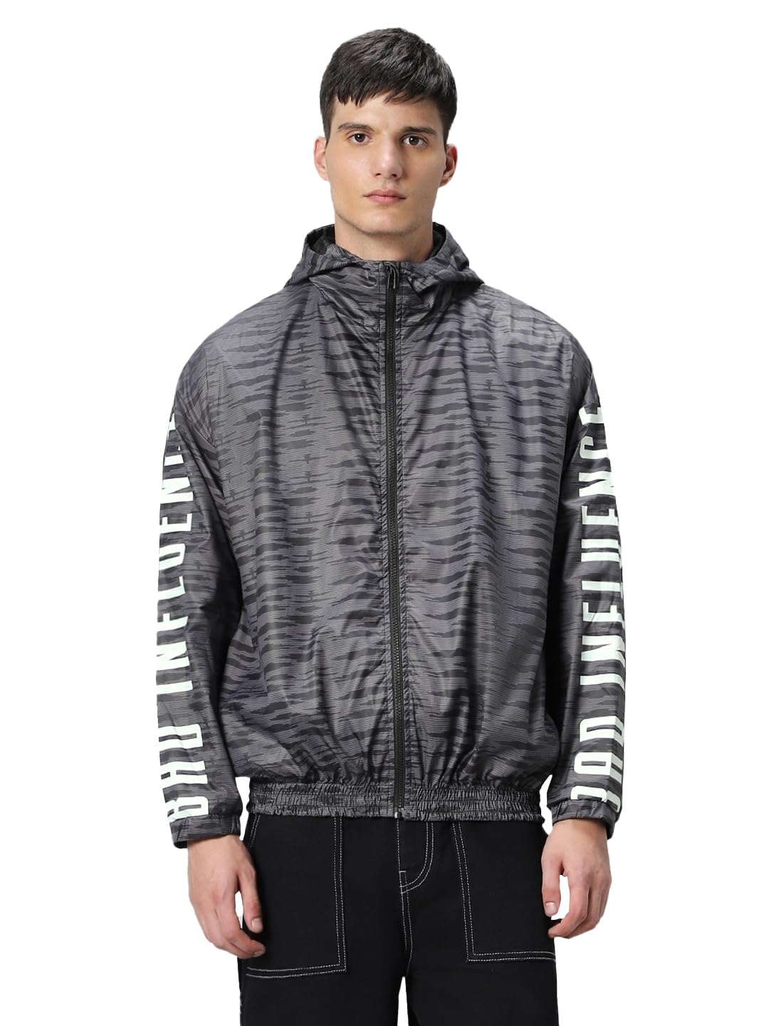Bewakoof Air 1.0 Mens Typography Super Loose Fit Full Sleeve Hooded Neck Nylon Windcheater Jacket_ 601628 Grey XL