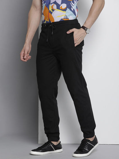 The Indian Garage Co Men Regular Fit Solid Mid-Rise Woven Joggers Black