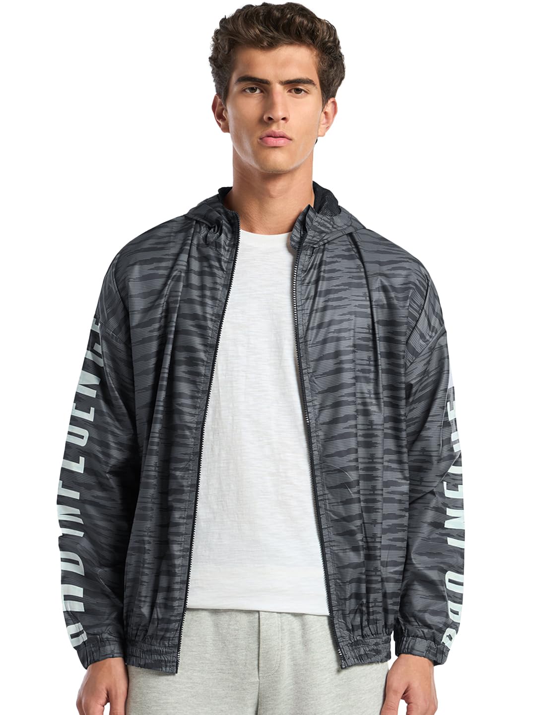 Bewakoof Air 1.0 Mens Typography Super Loose Fit Full Sleeve Hooded Neck Nylon Windcheater Jacket_ 601628 Grey S